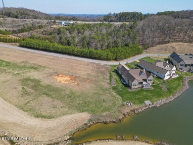 Discover unparalleled beauty within WindRiver Golf and Lakefront on Wind River Golf Course in Tennessee - for sale on GolfHomes.com, golf home, golf lot