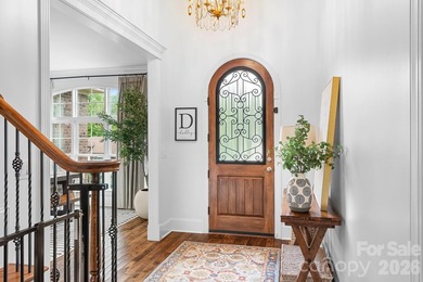 Beautifully updated and impeccably maintained, this custom brick on Cowans Ford Country Club in North Carolina - for sale on GolfHomes.com, golf home, golf lot