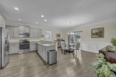 A beautifully upgraded residence in Waterford of the Carolinas on Magnolia Greens Golf Plantation in North Carolina - for sale on GolfHomes.com, golf home, golf lot