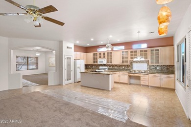 Step into this warm and welcoming, meticulously maintained home on Estrella Mountain Ranch Golf Course in Arizona - for sale on GolfHomes.com, golf home, golf lot