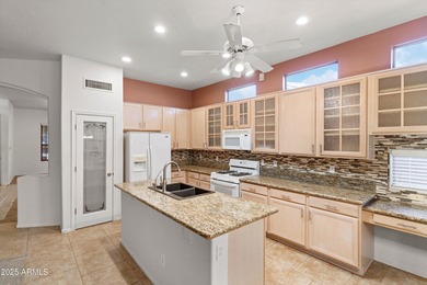 Step into this warm and welcoming, meticulously maintained home on Estrella Mountain Ranch Golf Course in Arizona - for sale on GolfHomes.com, golf home, golf lot