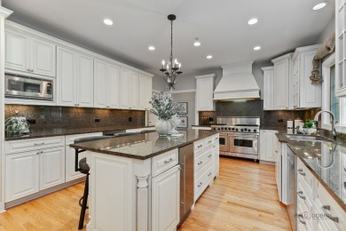 Welcome to this elegant and spacious 5-bedroom, 3.1-bath home on Royal Melbourne in Illinois - for sale on GolfHomes.com, golf home, golf lot