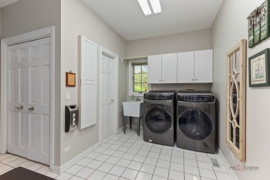 Welcome to this elegant and spacious 5-bedroom, 3.1-bath home on Royal Melbourne in Illinois - for sale on GolfHomes.com, golf home, golf lot