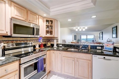 Breathtaking river views welcome you to this first-floor on Ocean Club At the Hutchinson Island Beach Resort in Florida - for sale on GolfHomes.com, golf home, golf lot