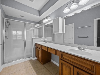 Enjoy Florida living in this delightful first-floor, end unit on ChampionsGate Golf Resort in Florida - for sale on GolfHomes.com, golf home, golf lot