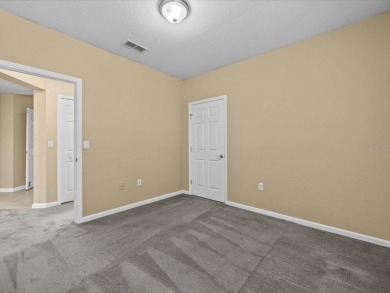 Enjoy Florida living in this delightful first-floor, end unit on ChampionsGate Golf Resort in Florida - for sale on GolfHomes.com, golf home, golf lot