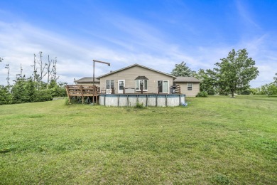Well-maintained 4 bedroom, 2 bath home offering a spacious and on The Loon Golf Resort in Michigan - for sale on GolfHomes.com, golf home, golf lot