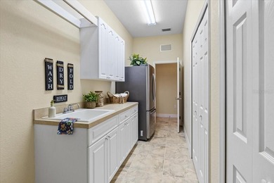 Tucked away on a private interior street off the main on River Wilderness Golf and Country Club in Florida - for sale on GolfHomes.com, golf home, golf lot