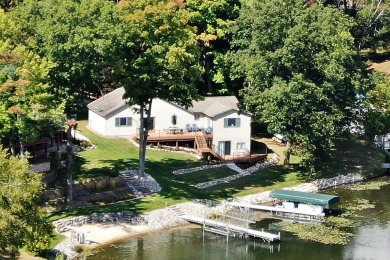 Discover your dream getaway on All Sports Lake Mecosta, part of on St. Ives Golf Club in Michigan - for sale on GolfHomes.com, golf home, golf lot