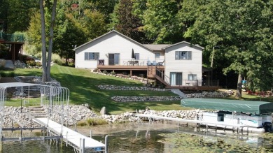 Discover your dream getaway on All Sports Lake Mecosta, part of on St. Ives Golf Club in Michigan - for sale on GolfHomes.com, golf home, golf lot