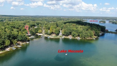 Discover your dream getaway on All Sports Lake Mecosta, part of on St. Ives Golf Club in Michigan - for sale on GolfHomes.com, golf home, golf lot