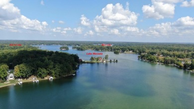 Discover your dream getaway on All Sports Lake Mecosta, part of on St. Ives Golf Club in Michigan - for sale on GolfHomes.com, golf home, golf lot