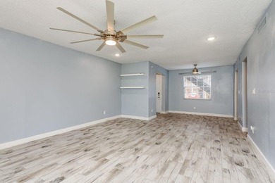 Welcome to this charming first-floor end-unit condo located in on East Bay Golf Club in Florida - for sale on GolfHomes.com, golf home, golf lot