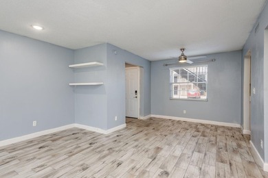 Welcome to this charming first-floor end-unit condo located in on East Bay Golf Club in Florida - for sale on GolfHomes.com, golf home, golf lot