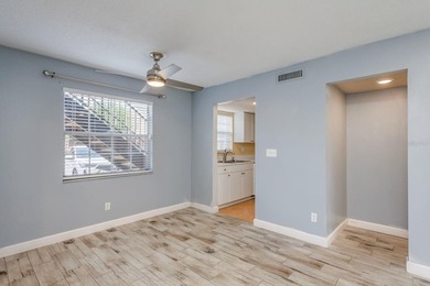 Welcome to this charming first-floor end-unit condo located in on East Bay Golf Club in Florida - for sale on GolfHomes.com, golf home, golf lot