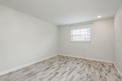 Welcome to this charming first-floor end-unit condo located in on East Bay Golf Club in Florida - for sale on GolfHomes.com, golf home, golf lot