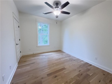 This home features beautiful woods floors throughout the home on Branchwood Golf Course in Arkansas - for sale on GolfHomes.com, golf home, golf lot