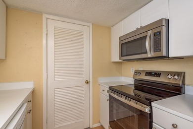 Welcome to this charming first-floor end-unit condo located in on East Bay Golf Club in Florida - for sale on GolfHomes.com, golf home, golf lot