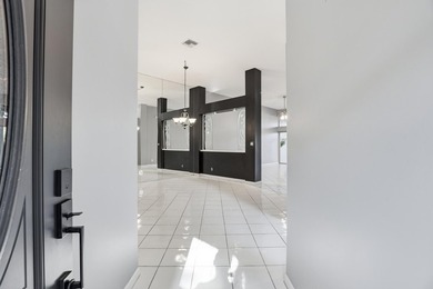 Enjoy relaxed South Florida living in this inviting 3-bedroom on Boca Delray Golf and Country Club in Florida - for sale on GolfHomes.com, golf home, golf lot