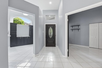 Enjoy relaxed South Florida living in this inviting 3-bedroom on Boca Delray Golf and Country Club in Florida - for sale on GolfHomes.com, golf home, golf lot