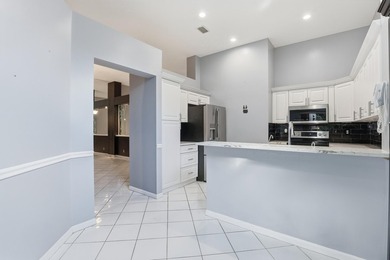 Enjoy relaxed South Florida living in this inviting 3-bedroom on Boca Delray Golf and Country Club in Florida - for sale on GolfHomes.com, golf home, golf lot