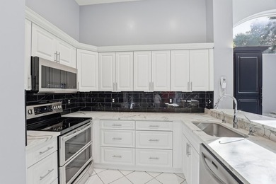 Enjoy relaxed South Florida living in this inviting 3-bedroom on Boca Delray Golf and Country Club in Florida - for sale on GolfHomes.com, golf home, golf lot