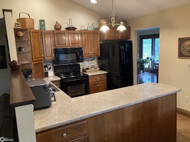 Nestled in a quiet, wooded neighborhood between Sunnyside Park & on Burlington Golf Club in Iowa - for sale on GolfHomes.com, golf home, golf lot