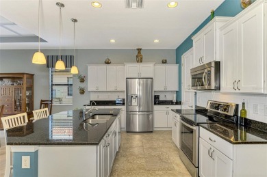 Prepare to be impressed by this beautifully upgraded one-owner on Sarasota National Golf Club in Florida - for sale on GolfHomes.com, golf home, golf lot