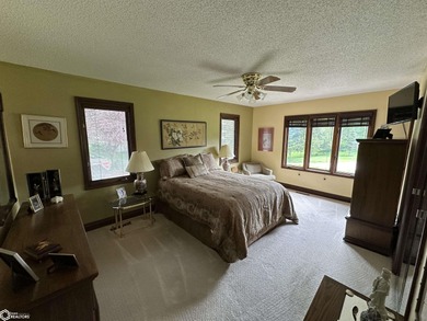 Nestled in a quiet, wooded neighborhood between Sunnyside Park & on Burlington Golf Club in Iowa - for sale on GolfHomes.com, golf home, golf lot