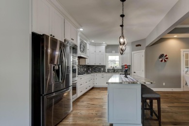 This elegant ranch on a basement offers refined main-level on Winchester Country Club, Inc. in Kentucky - for sale on GolfHomes.com, golf home, golf lot