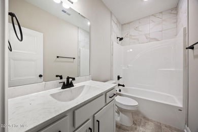 Discover your dream home where elegance meets functionality in a on Deercroft Golf and Country Club in North Carolina - for sale on GolfHomes.com, golf home, golf lot