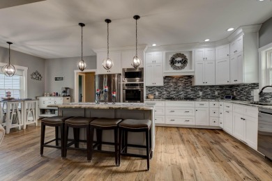 This elegant ranch on a basement offers refined main-level on Winchester Country Club, Inc. in Kentucky - for sale on GolfHomes.com, golf home, golf lot