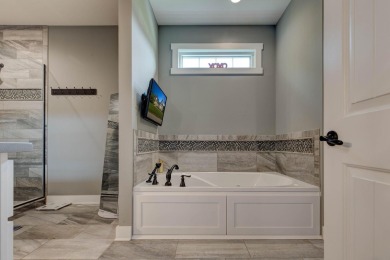 This elegant ranch on a basement offers refined main-level on Winchester Country Club, Inc. in Kentucky - for sale on GolfHomes.com, golf home, golf lot