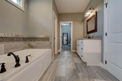 This elegant ranch on a basement offers refined main-level on Winchester Country Club, Inc. in Kentucky - for sale on GolfHomes.com, golf home, golf lot