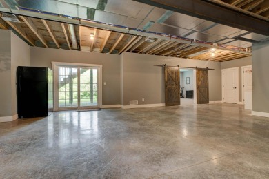 This elegant ranch on a basement offers refined main-level on Winchester Country Club, Inc. in Kentucky - for sale on GolfHomes.com, golf home, golf lot
