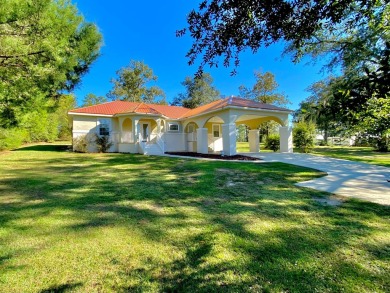 Elegant Arched views of Dogwood Lake presents both peace and on Dogwood Lakes Golf Club in Florida - for sale on GolfHomes.com, golf home, golf lot