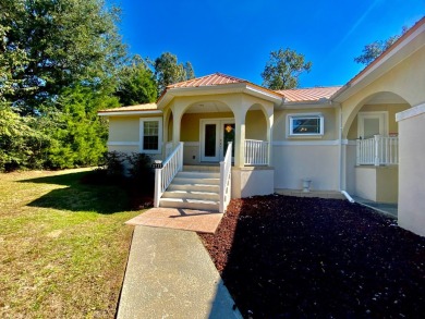 Elegant Arched views of Dogwood Lake presents both peace and on Dogwood Lakes Golf Club in Florida - for sale on GolfHomes.com, golf home, golf lot