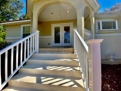 Elegant Arched views of Dogwood Lake presents both peace and on Dogwood Lakes Golf Club in Florida - for sale on GolfHomes.com, golf home, golf lot