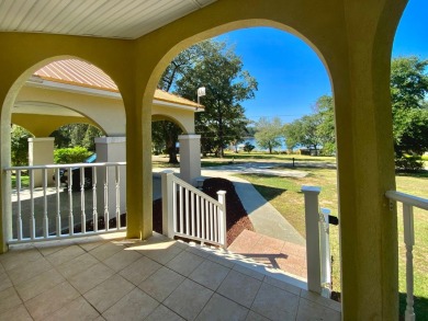 Elegant Arched views of Dogwood Lake presents both peace and on Dogwood Lakes Golf Club in Florida - for sale on GolfHomes.com, golf home, golf lot