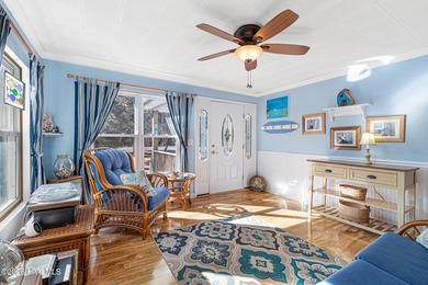 Canalfront 4-bedroom home situated on a private lot in Pine on The Country Club of the Crystal Coast in North Carolina - for sale on GolfHomes.com, golf home, golf lot