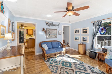 Canalfront 4-bedroom home situated on a private lot in Pine on The Country Club of the Crystal Coast in North Carolina - for sale on GolfHomes.com, golf home, golf lot