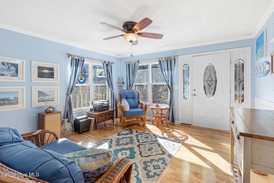 Canalfront 4-bedroom home situated on a private lot in Pine on The Country Club of the Crystal Coast in North Carolina - for sale on GolfHomes.com, golf home, golf lot