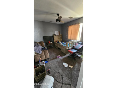 Investor special! Spacious 5-bedroom, 2.5-bath fixer-upper on Oasis Golf Club in Arizona - for sale on GolfHomes.com, golf home, golf lot