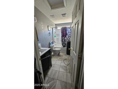 Investor special! Spacious 5-bedroom, 2.5-bath fixer-upper on Oasis Golf Club in Arizona - for sale on GolfHomes.com, golf home, golf lot