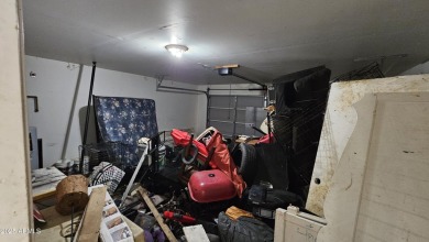 Investor special! Spacious 5-bedroom, 2.5-bath fixer-upper on Oasis Golf Club in Arizona - for sale on GolfHomes.com, golf home, golf lot