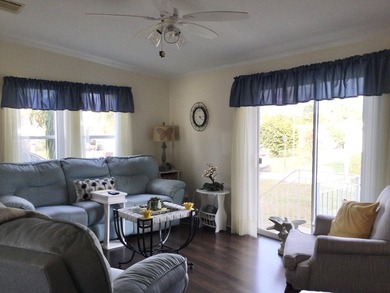 Meticulously maintained home situated at the end of a quiet on Spanish Lakes I in Florida - for sale on GolfHomes.com, golf home, golf lot