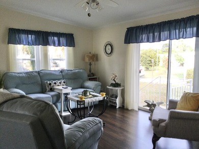 Meticulously maintained home situated at the end of a quiet on Spanish Lakes I in Florida - for sale on GolfHomes.com, golf home, golf lot