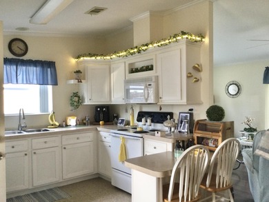 Meticulously maintained  home situated at the end of a quiet on Spanish Lakes I in Florida - for sale on GolfHomes.com, golf home, golf lot