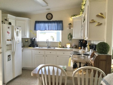 Meticulously maintained  home situated at the end of a quiet on Spanish Lakes I in Florida - for sale on GolfHomes.com, golf home, golf lot