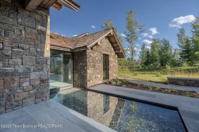 Set on a 2.43-acre Estate lot in 3 Creek Ranch, Mirror Pond on 3 Creek Ranch Golf Club in Wyoming - for sale on GolfHomes.com, golf home, golf lot
